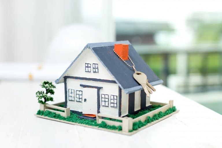 real estate with house model keys